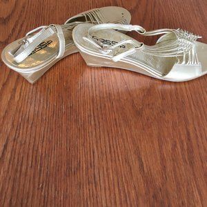 Gold wedge sandals with matching bag